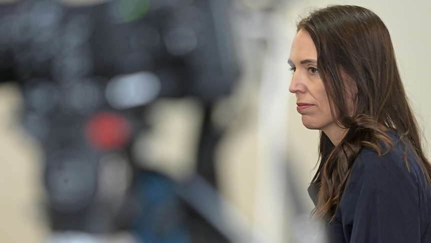 NZ Prime Minister looks solemn as she announces her resignation 