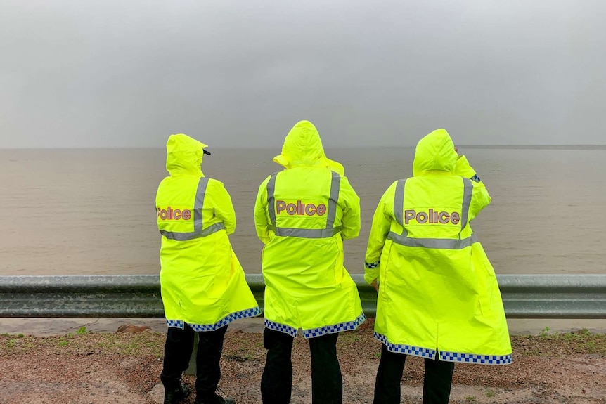 Police watch as floodwaters rise in Townsville