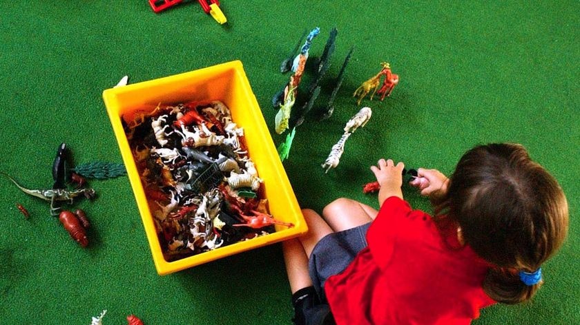 A child plays with toys