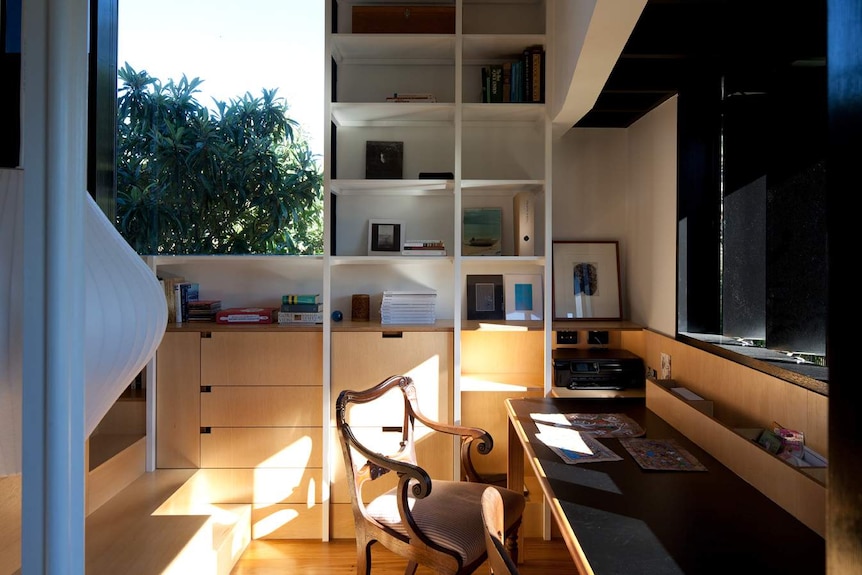An interiors shot of a small library, office space within the restored Queenslander