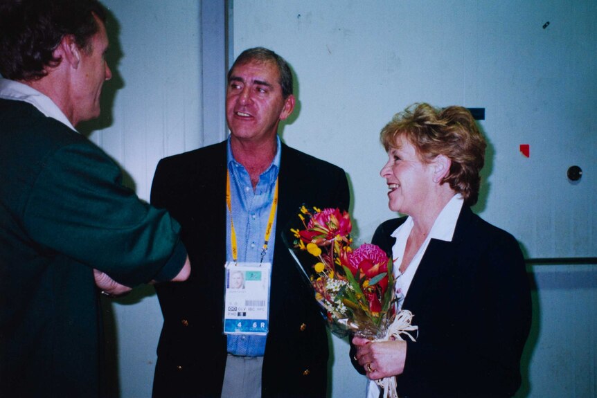 Former New South Wales premier John Fahey inspects the Sydney Olympics bouquet design in 2000