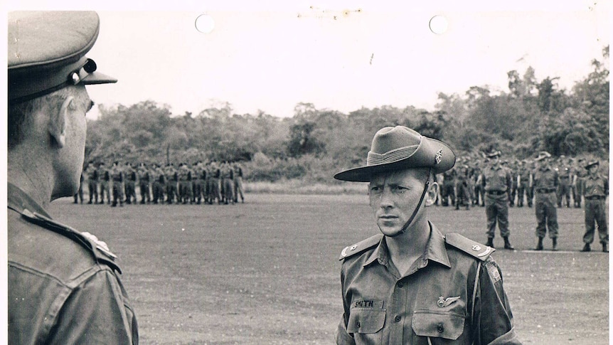 A black-and-white photo of a young army soldier in the 1970s.