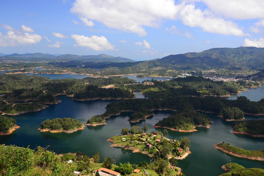 An aerial shot shows little islands dotted in the Guatape reservoir in colombia near medellin