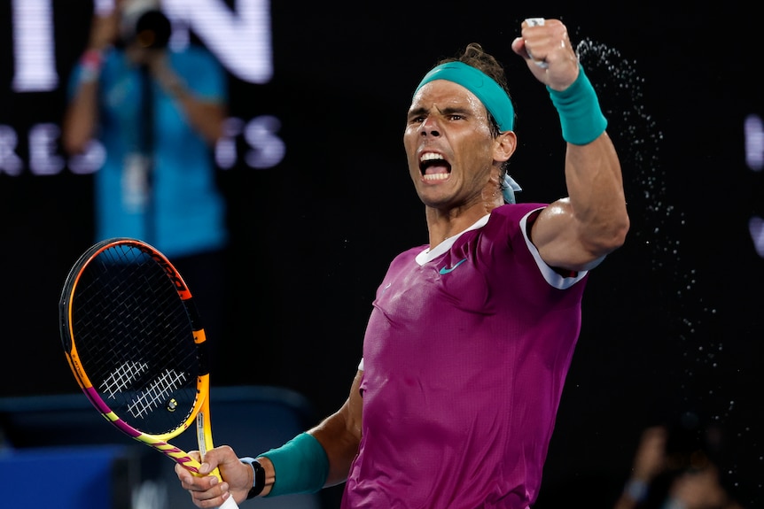 Tennis player Rafael Nadal pumps his fist and shouts during the Australian Open final
