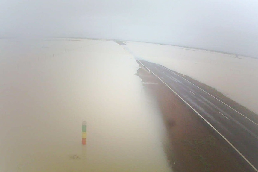 Flooded road in Gulf of Carpentaria after deluge in north-west Queensland.