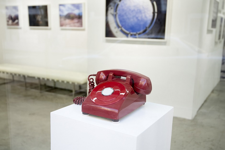 A photo of a red emergency hotline telephone.