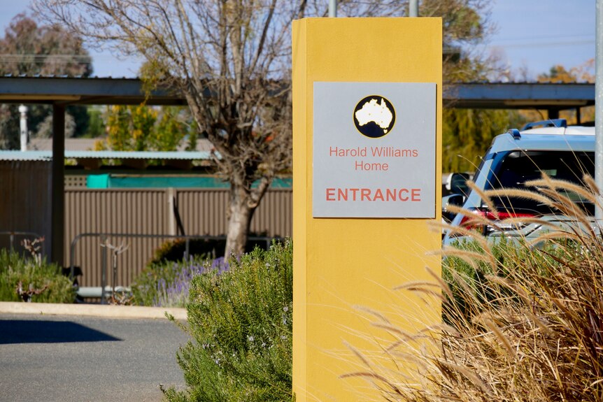 The yellow entry sign at the Harold Williams Home in Broken Hill. 