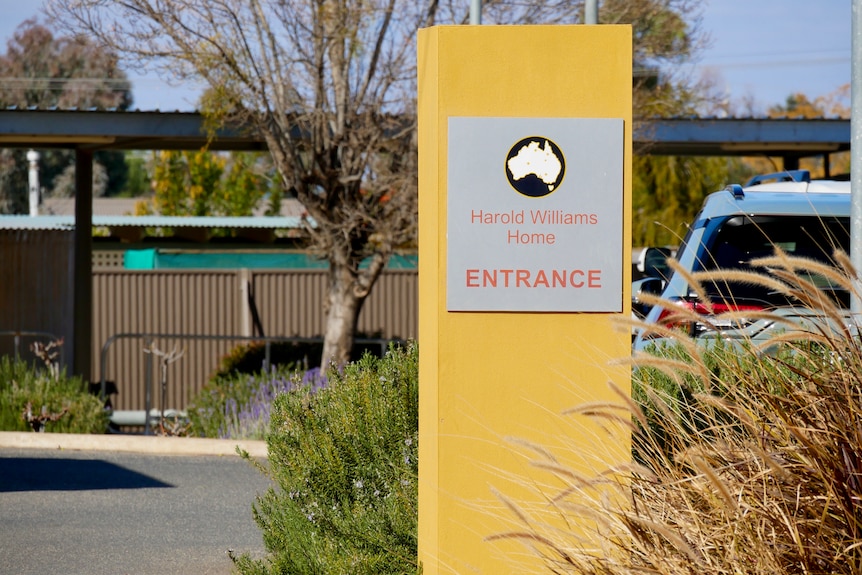 The yellow entry sign at the Harold Williams Home in Broken Hill. 