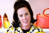 Designer Kate Spade poses with handbags and shoes.