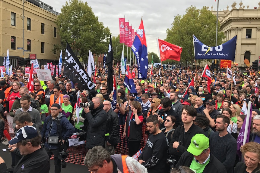 Hundreds of union members spread over an intersection.