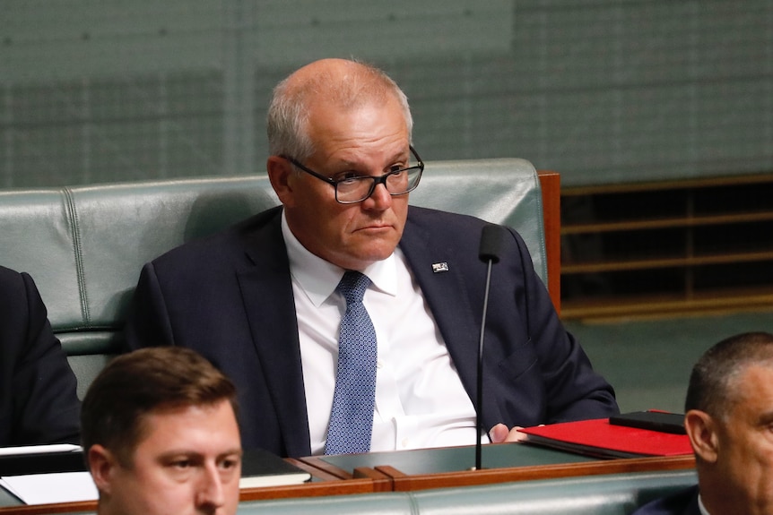 Morrison looks on while watching proceedings in the lower house.