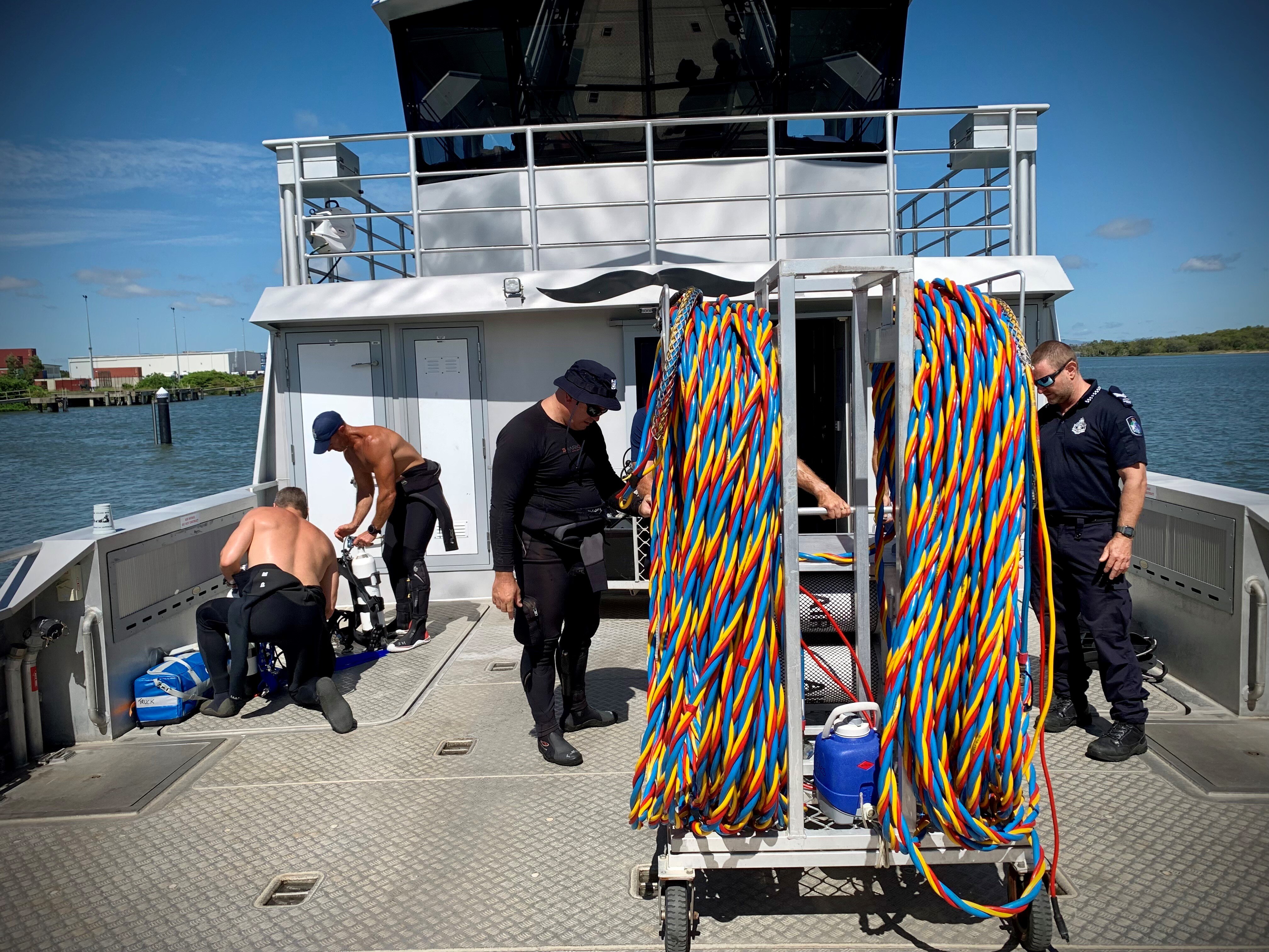 Police divers in the search for missing boaties in Moreton Bay