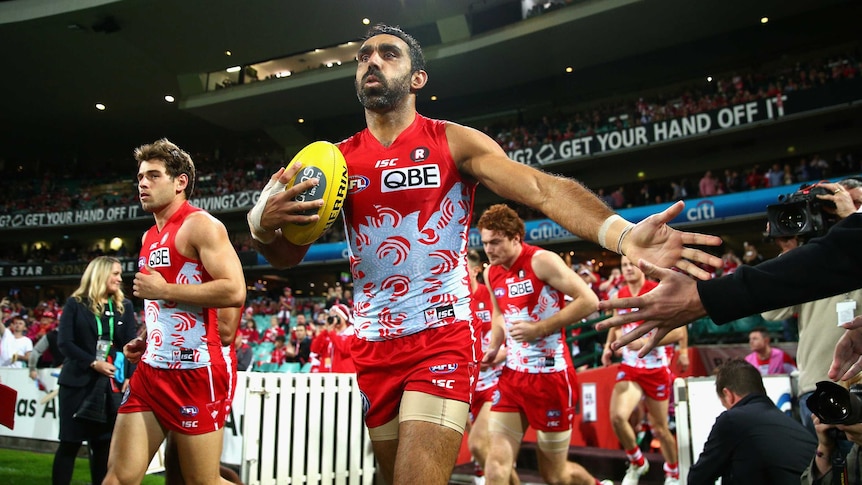 Adam Goodes leads the Sydney Swans out at the SCG against Carlton on May 29, 2015.