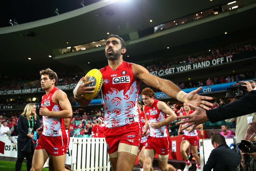 Adam Goodes leads the Swans out