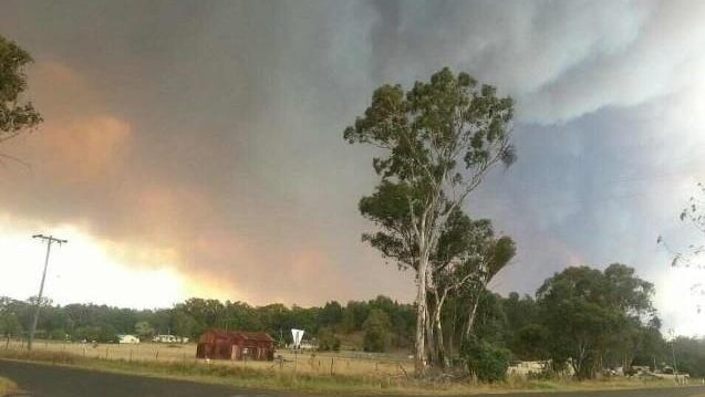 Smoke is seen rising from the fires westwards from the Coonabarabran racecourse.