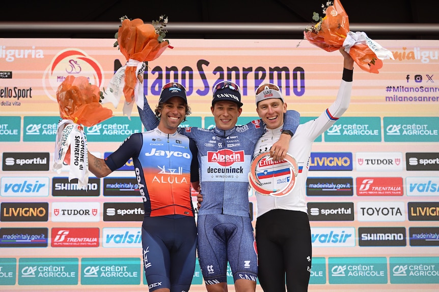 The podium finishes in the Milan-San Remo race pose for a photograph.