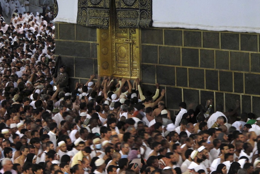 Muslim pilgrims pray at the Grand Mosque in Mecca