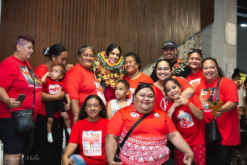 Hulita captain of Tonga  with family at the airport
