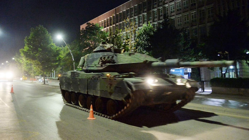 A Turkish army tank drives on a street in Ankara