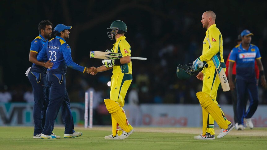 Adam Zampa and Sri Lanka's Tillakaratne Dilshan shake hands after Australia's ODI win in Dambulla.