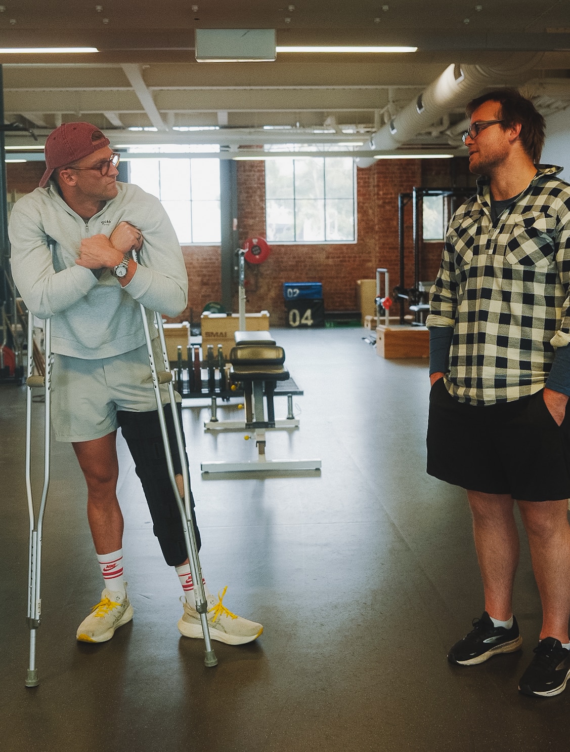 Sam Williamson, on crutches, and VIS gym coach Jono Wallace