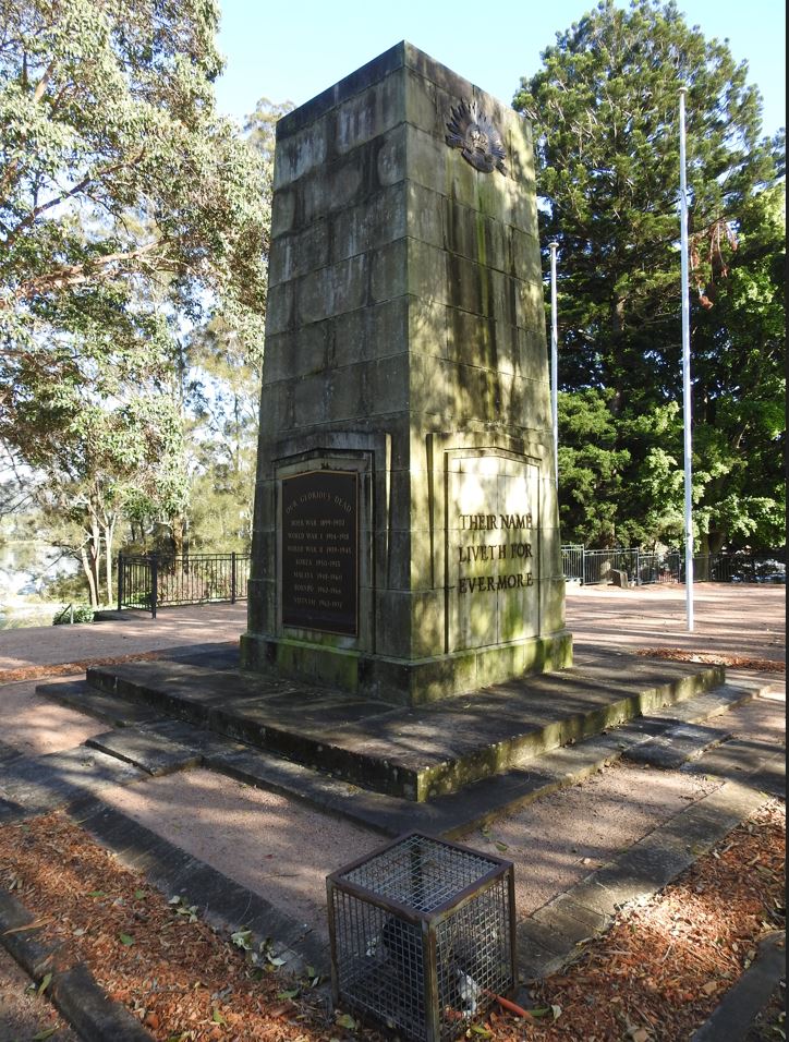 Gosford Cenotaph sits covered in green moss. 