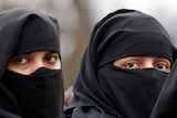 Veiled Muslim women look towards camera in Saudi Arabia