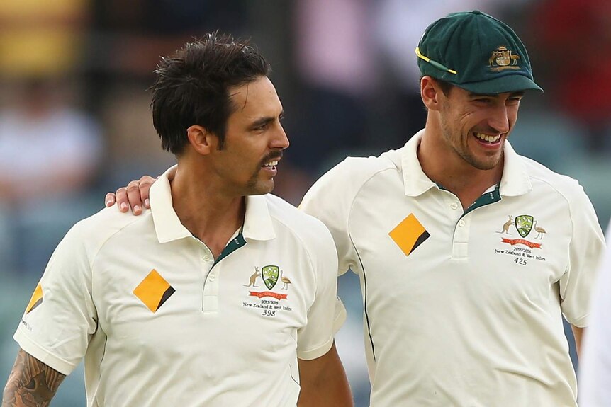 Mitchell Johnson is embraced by Starc