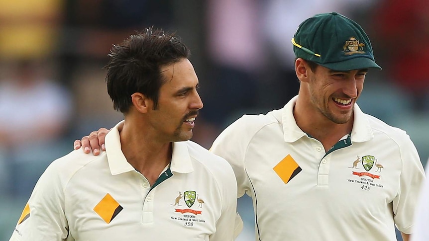 Mitchell Johnson is embraced by Starc