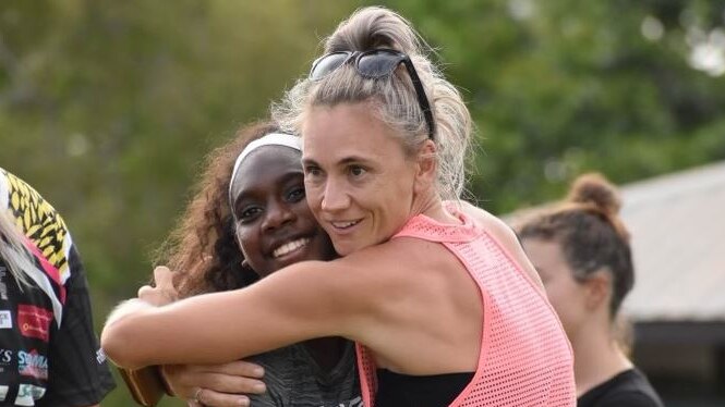 CJ Ranking recieves a hug from her running coach Tara Everitt