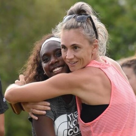 CJ Ranking recieves a hug from her running coach Tara Everitt