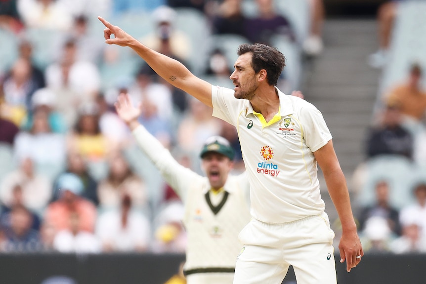 Australia bowler Mitchell Starc points as he appeals for a South Africa wicket in the Boxing Day Test.