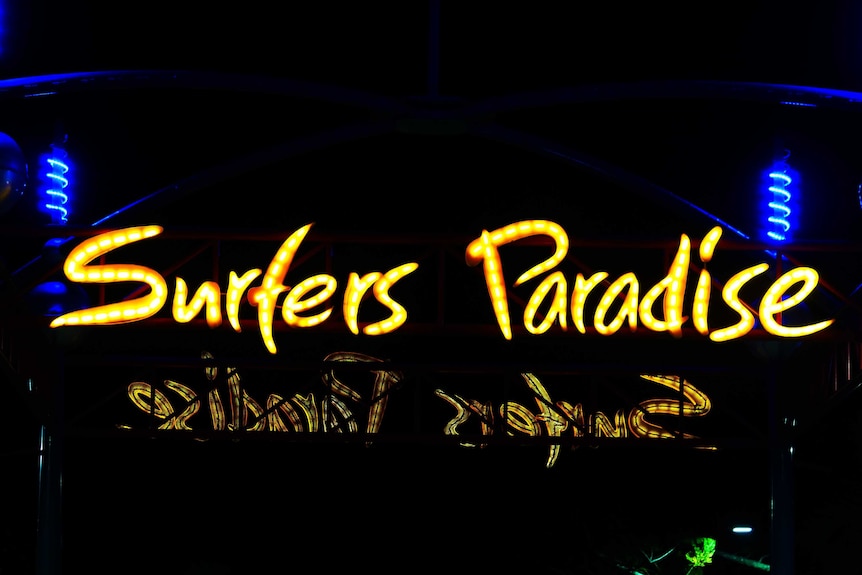 neon sign saying surfers paradise