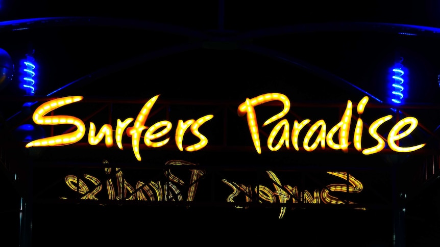 neon sign saying surfers paradise