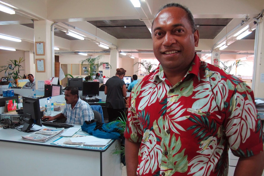 Fiji Times newspaper editor Fred Wesley stands in the newsroom in Suva