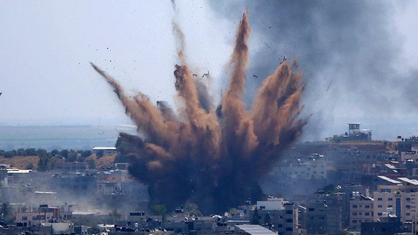 Gaza conflict intensifies with rocket barrages and air strikes as Israel amasses troops on border
