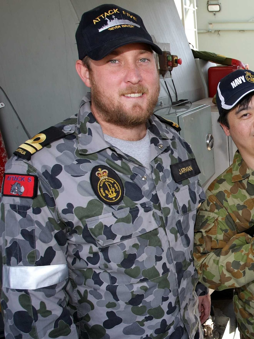Lieutenant Scott Jarman with a visitor to HMAS Bathurst during Exercise Boss Lift 2012.