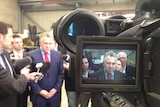 Joe Hockey surrounded by reporters