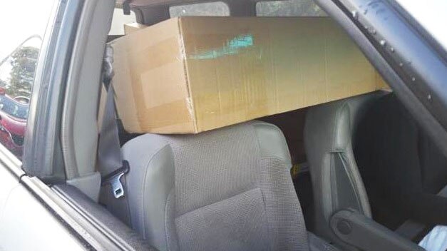 The driver and passenger in the front seats rested their heads on the flat pack, police said.