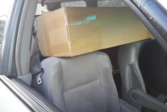 The driver and passenger in the front seats rested their heads on the flat pack, police said.