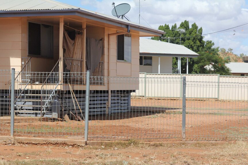 A bare dirt front yard in Mount Isa
