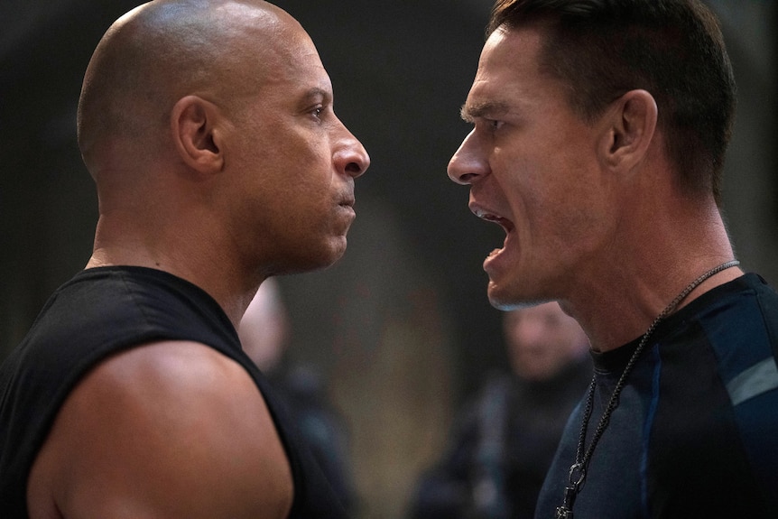 A still from a film with Vin Diesel and John Cena face to face.