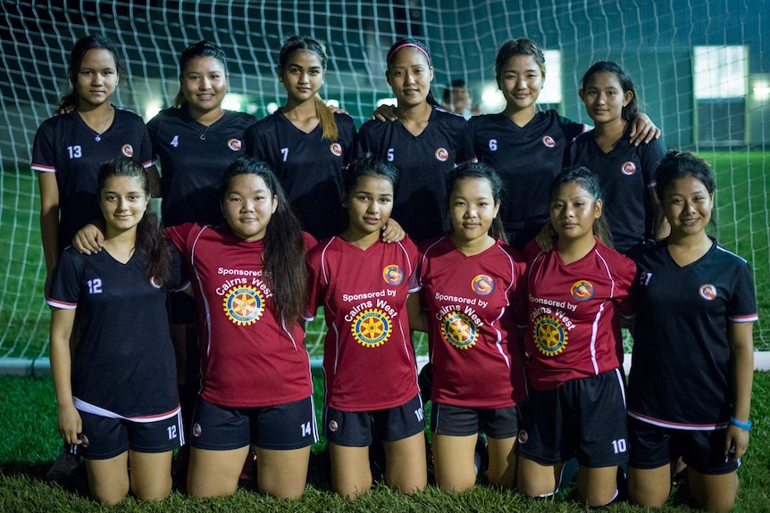 A team photo of a group of female Bhutanese refugees that have formed a soccer team in Cairns.