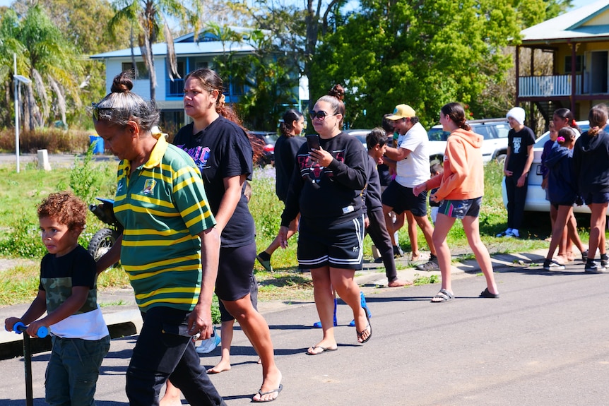 Cabbage Tree Island residents walking down street
