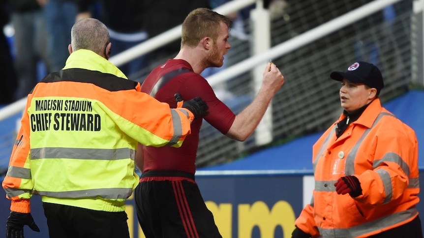 West Brom's Chris Brunt reacts after he was hit by object after his side's FA Cup loss to Reading.