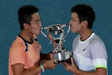 Rinky Hijikata and Jason Kubler kiss a silver trophy