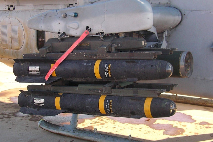 Hellfire missiles loaded onto the rails of a United States Marine Corps AH-1W Super Cobra in 2005.