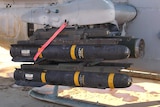 Hellfire missiles loaded onto the rails of a United States Marine Corps AH-1W Super Cobra in 2005.