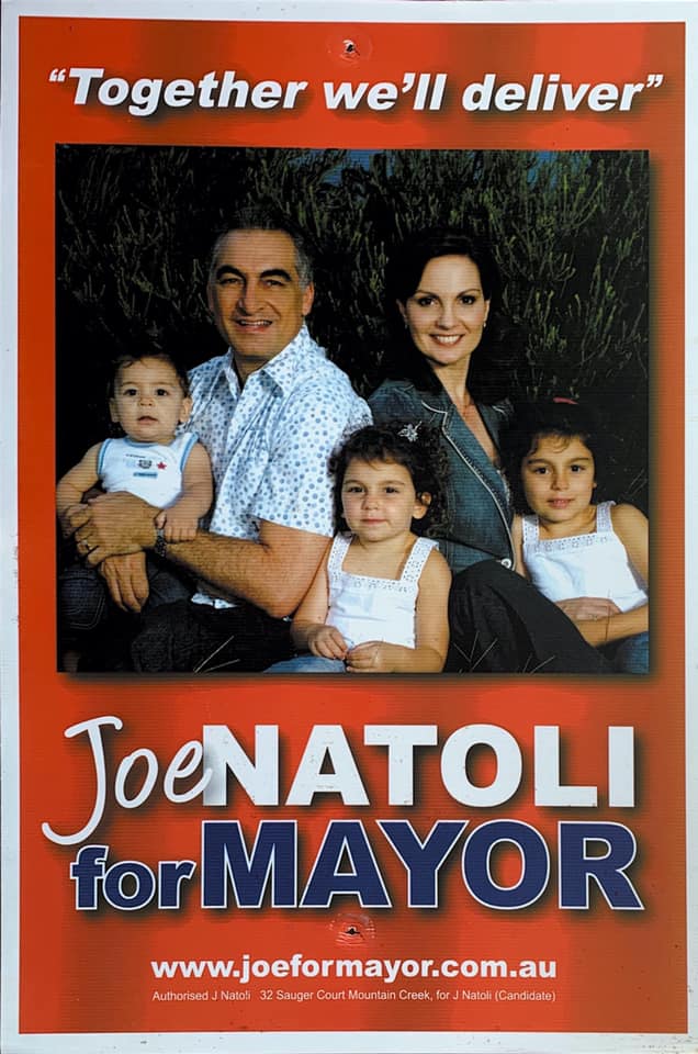A family photo on a campaign sign 