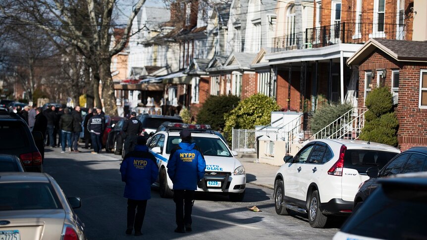 Police block off a residential street in Brooklyn.